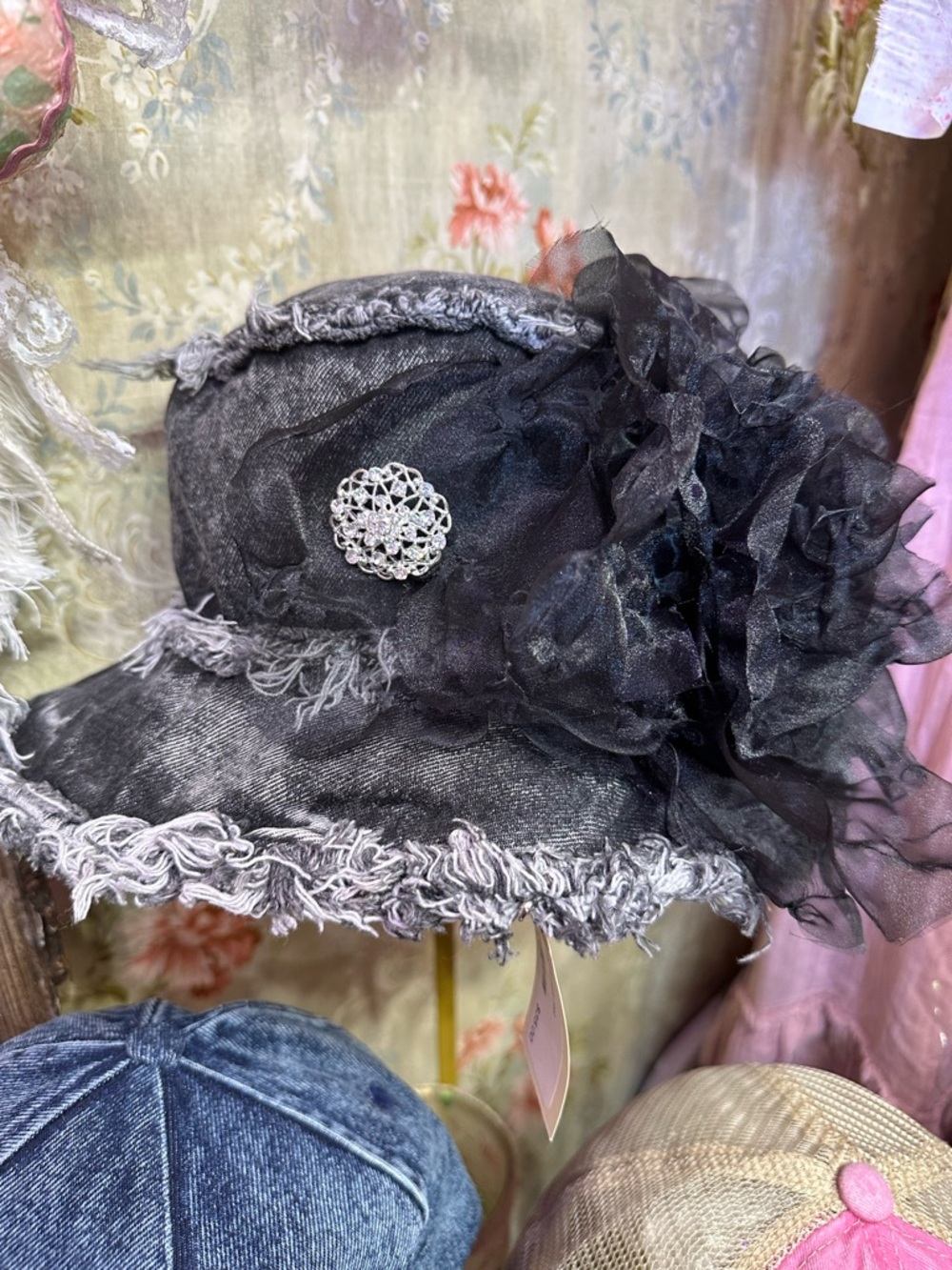 Embellished bucket in washed faded denim frayed edges, organza Flower w/brooch.